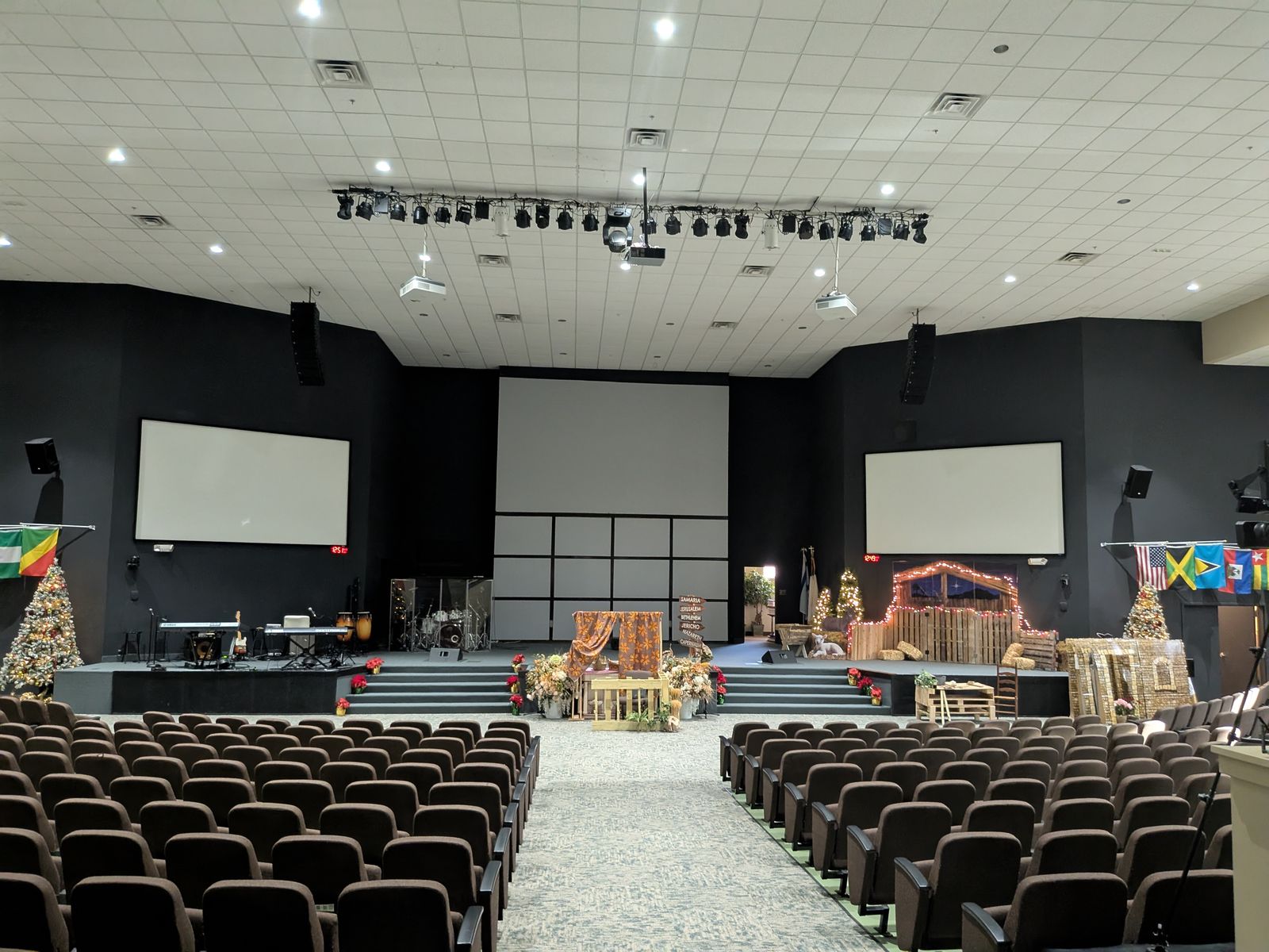 JPower sanctuary before the LED installation, with side projection screens flanking a center screen